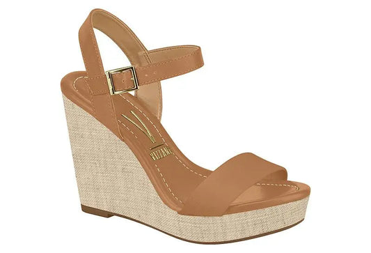 Vizzano wedge sandal featuring a light brown leather upper, a beige canvas wedge sole, and a gold buckle detail