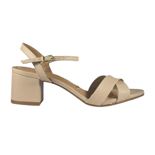 Product shot of a beige leather sandal with a gold buckle and crisscross straps on a block heel a stylish summer shoe