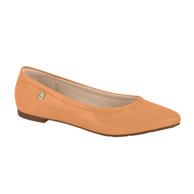 Product shot of a light orange women's flat shoe featuring a subtle gold logo and a slightly pointed toe showcasing a minimalist design with a comfortable sole