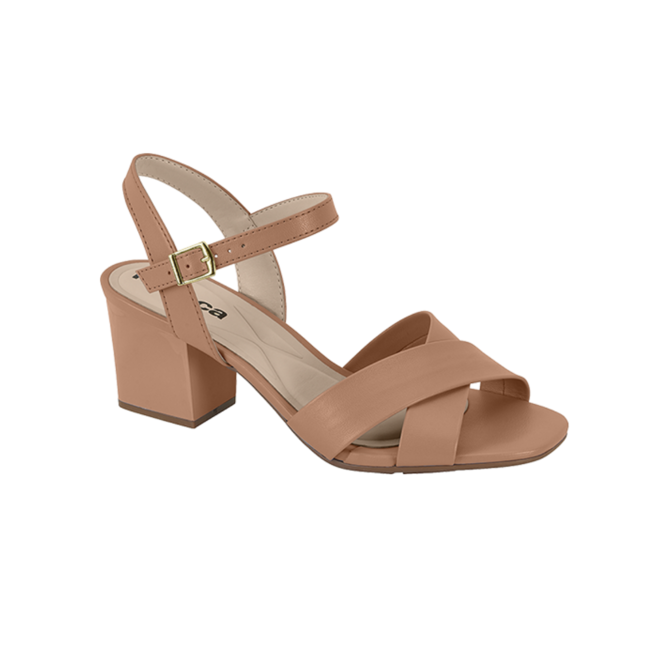 Product shot of a beige leather sandal with a gold buckle and crisscross straps on a block heel