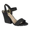 Product shot of a black women's sandal with a gold buckle and textured block heel featuring a beige insole and a simple design
