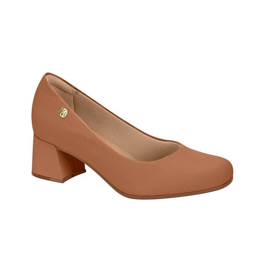 Product shot of a light brown, low block-heeled pump with a gold logo detail and a slightly rounded toe
