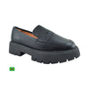 Product shot of a Brazilian-made black leather penny loafer featuring a chunky platform sole a subtle stitch detail and a soft inner lining
