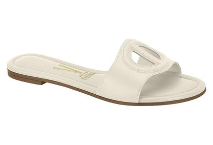 Vizzano off-white leather slide sandal featuring a cutout circular design, a brown sole, and gold logo detailing
