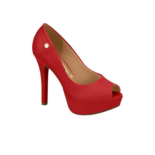 Product shot of a red platform peep-toe high-heel shoe featuring a gold logo and a subtle platform sole with a sleek silhouette
