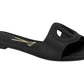 Vizzano black leather slide sandal featuring a cutout circular design gold logo and subtle stitching details
