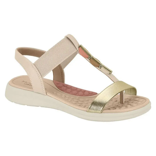 Product shot of a beige and gold Molly braided sandal featuring a comfortable footbed and a unique decorative accent in coral and brown tones

