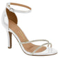 Product shot of a Vizzano white patent leather sandal with ankle strap featuring a rhinestone crisscross detail and nude insole