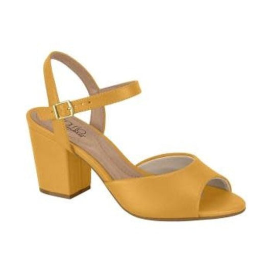 Product shot of a mustard yellow peep-toe heeled sandal with a gold buckle and a chunky block heel showcasing smooth leather and a comfortable design
