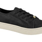 Product shot of a black suede sneaker with off-white sole and gold aglets showcasing textured fabric and a ribbed sole
