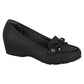 Product shot of a black wedge loafer with gold accents and a subtle bow detail showcasing a textured upper and a slightly chunky sole
