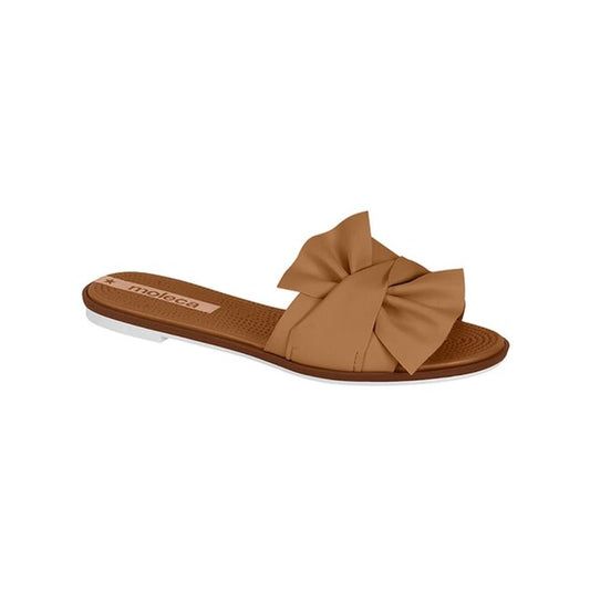 Moleca brown slide sandal featuring a large fabric bow a textured footbed and a contrasting white sole
