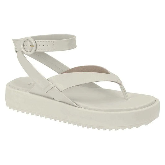 Product shot of off-white leather platform sandal featuring an ankle strap with buckle and textured sole.
