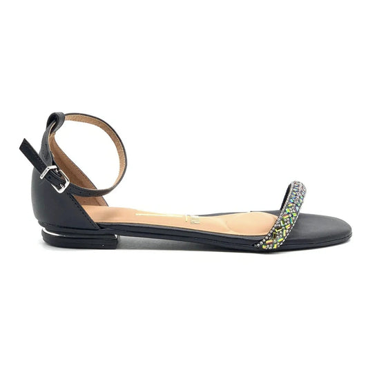 Product shot of a black Vizzano women's sandal featuring a jeweled ankle strap iridescent green and black embellishments and a low block heel
