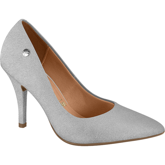 Product shot of a silver glitter women's high heel pump featuring a pointed toe, tan insole, and small metallic button detail on the side
