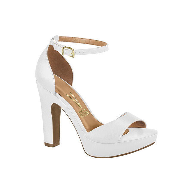 Product shot of a Vizzano white platform sandal featuring a gold buckle ankle strap a peep toe and a chunky heel
